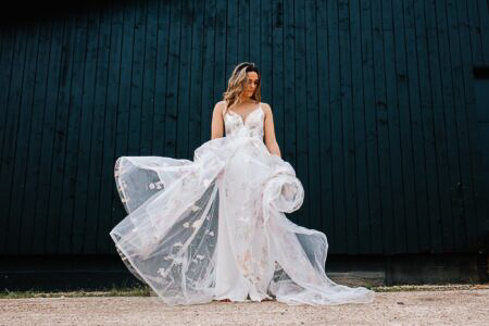 Bride in hand-pianted Savin Wedding Dress at Silchester Farm